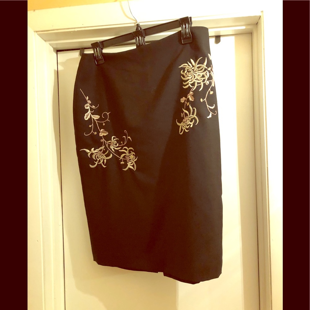 Black embroidered skirt with back split.